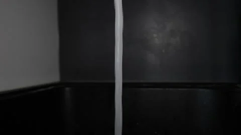 Close up on tap water in slow motion Stock Footage 252115595