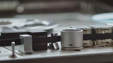 Close up of tape rolling in Nagra old professional tape recorder. Camera Stock-Footage 160119762