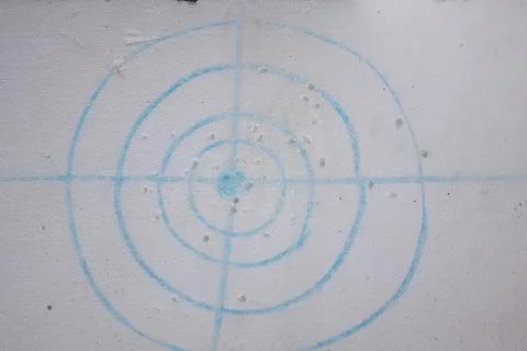 Close-up of a target pattern printed on a foam board with multiple impact mar Stock Photos