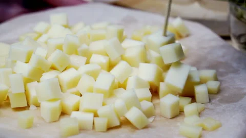 Close-up of tasting diced cheese. Stock Footage 154849167