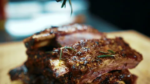 Close up of tasty beef ribs are being served in expensive restaurant, slow Stock Footage 90364584