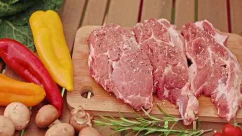 Close-up of tasty beef steak that is sprinkled with barbeque ingredients. Stock Footage 217513792