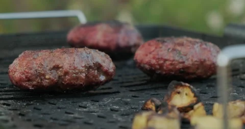 Close-up Of Tasty Fried Meat Cutlets. Cutlets for Burgers. Fry Meat on Street Stock Footage 132986965