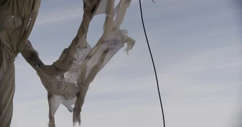 Close Up of Tattered Curtains Blowing in Wind with Crash Zoom in Stock Footage 89943211