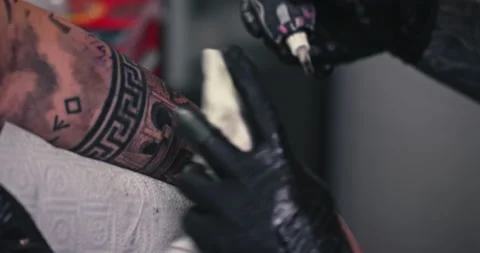 Close up tattoo artist shows the process of getting tattoos with paint. Stock Footage 236330338