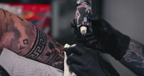 Close up tattoo artist shows the process of getting tattoos with paint. Stock Footage 236330505