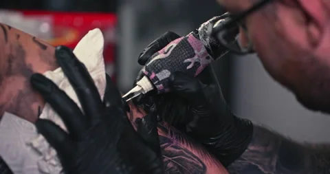 Close up tattoo artist shows the process of getting tattoos with paint. Stock Footage 236330759