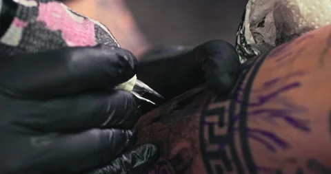 Close up tattoo artist shows the process of getting tattoos with paint. Stock Footage 236330896
