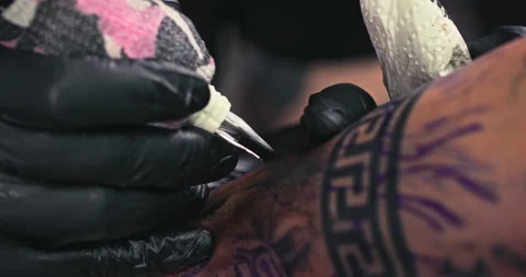 Close up tattoo artist shows the process of getting tattoos with paint. Stock Footage 236331642