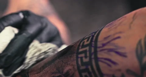 Close up tattoo artist shows the process of getting tattoos with paint. Stock Footage 236331680