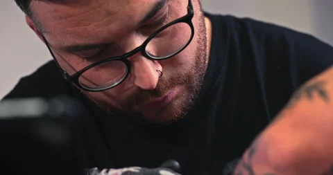 Close up tattoo artist shows the process of getting tattoos with paint. Stock Footage 236331744