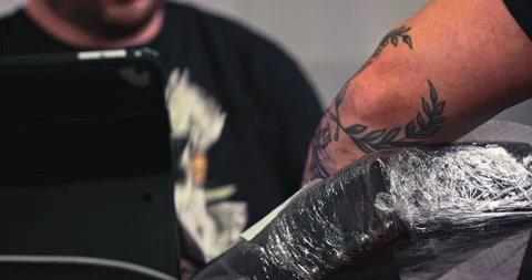 Close up tattoo artist shows the process of getting tattoos with paint. Stock Footage 236331876