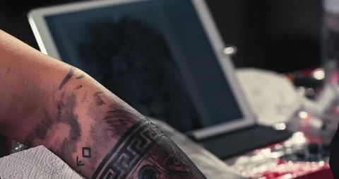 Close up tattoo artist shows the process of getting tattoos with paint. Stock Footage 236332731