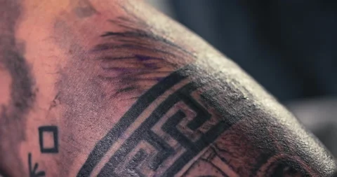 Close up tattoo artist shows the process of getting tattoos with paint. Stock Footage 236332736