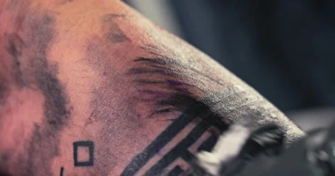 Close up tattoo artist shows the process... | Stock Video | Pond5