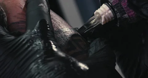 Close up tattoo artist shows the process of getting tattoos with paint. Stock Footage 236333205