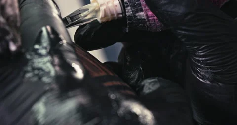 Close up tattoo artist shows the process of getting tattoos with paint. Stock Footage 236333498