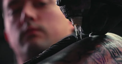Close up tattoo artist shows the process of getting tattoos with paint. Stock Footage 236333771