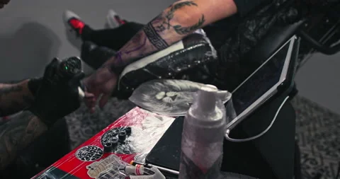 Close up tattoo artist shows the process of getting tattoos with paint. Stock Footage 236334769