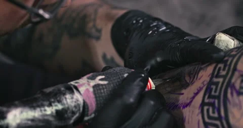 Close up tattoo artist shows the process of getting tattoos with paint. Stock Footage 236335636