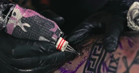 Close up tattoo artist shows the process of getting tattoos with paint. Stock Footage 236336114