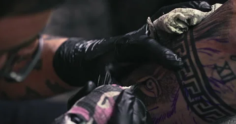 Close up tattoo artist shows the process of getting tattoos with paint. Stock Footage 236336460