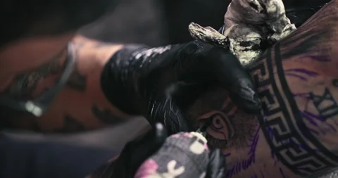 Close up tattoo artist shows the process of getting tattoos with paint. Stock Footage 236336544