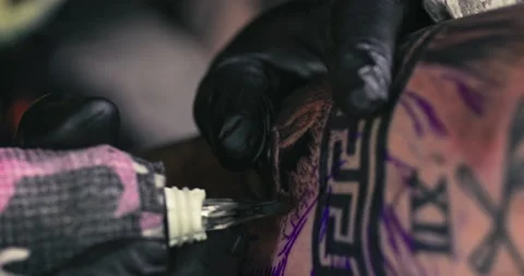 Close up tattoo artist shows the process of getting tattoos with paint. Stock Footage 236336821