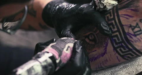 Close up tattoo artist shows the process of getting tattoos with paint. Stock Footage 236336847