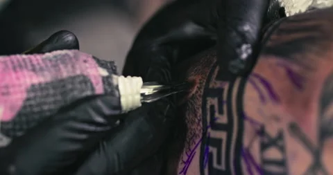 Close up tattoo artist shows the process of getting tattoos with paint. Stock Footage 236337156