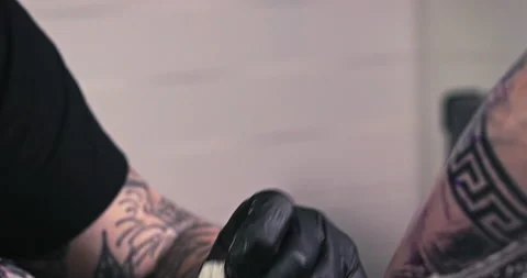 Close up tattoo artist shows the process of getting tattoos with paint. Stock Footage 236337420