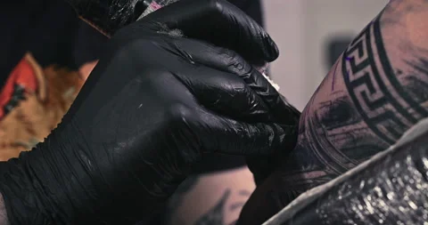 Close up tattoo artist shows the process of getting tattoos with paint. Stock Footage 236337470