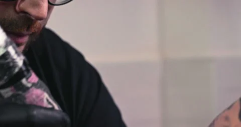 Close up tattoo artist shows the process of getting tattoos with paint. Stock Footage 236337632
