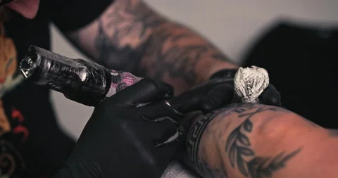 Close up tattoo artist shows the process of getting tattoos with paint. Stock Footage 236339393