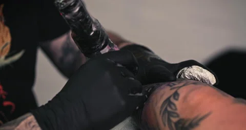 Close up tattoo artist shows the process of getting tattoos with paint. Stock Footage 236339690