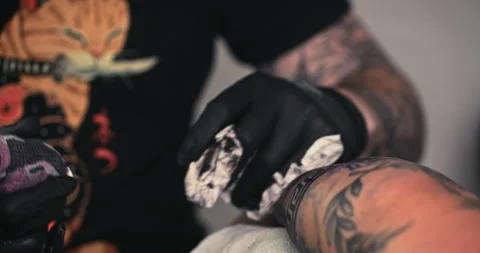 Close up tattoo artist shows the process of getting tattoos with paint. Stock Footage 236339736