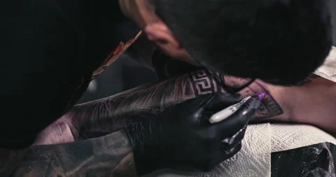 Close up tattoo artist shows the process of getting tattoos with paint. Stock Footage 236339974