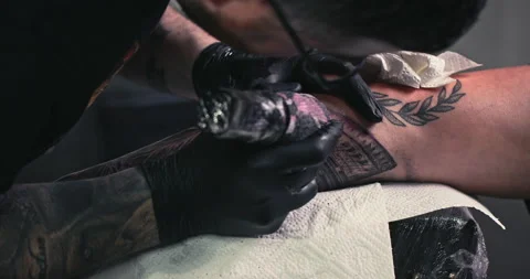 Close up tattoo artist shows the process of getting tattoos with paint. Stock Footage 236340209