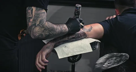 Close up tattoo artist shows the process of getting tattoos with paint. Stock Footage 236340653