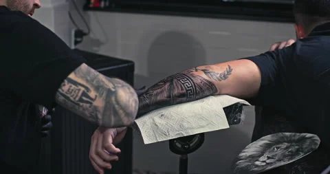 Close up tattoo artist shows the process of getting tattoos with paint. Stock Footage 236340655