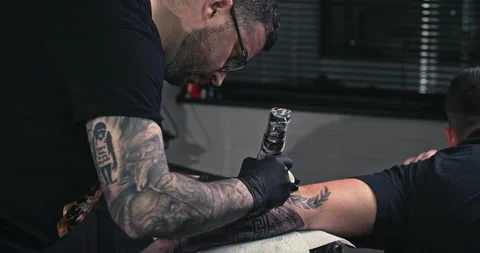 Close up tattoo artist shows the process of getting tattoos with paint. Stock Footage 236340798