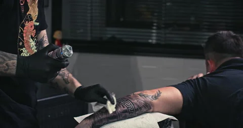 Close up tattoo artist shows the process of getting tattoos with paint. Stock Footage 236340907