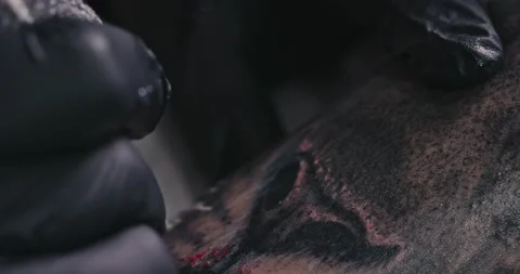 Close up tattoo artist shows the process of getting tattoos with paint. Stock Footage 236341318
