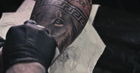 Close up tattoo artist shows the process of getting tattoos with paint. Stock Footage 236341698