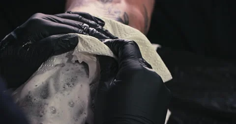 Close up tattoo artist shows the process of getting tattoos with paint. Stock Footage 236341706