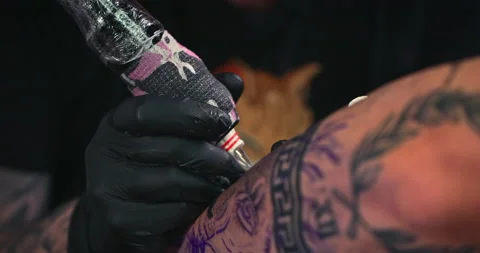 Close up tattoo artist shows the process of getting tattoos with paint. Stock Footage 236341902