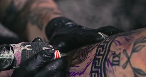 Close up tattoo artist shows the process of getting tattoos with paint. Stock Footage 236348818