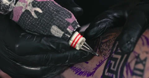 Close up tattoo artist shows the process of getting tattoos with paint. Stock Footage 236350698