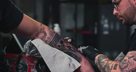 Close up tattoo artist shows the process of getting tattoos with paint. Stock Footage 236766085