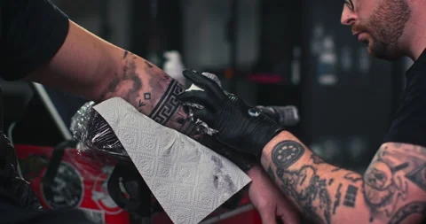 Close up tattoo artist shows the process of getting tattoos with paint. Stock Footage 236766097
